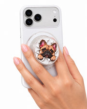 Clear personalized 3D MagSafe-compatible phone grip with French bulldog portrait held on a white phone
