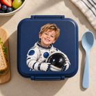 Personalized astronaut portrait UV DTF transfer on a navy lunchbox
