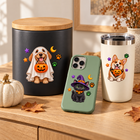 Spooky Pets Halloween UV DTF designs displayed on a warm oak console