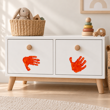 Children’s handprint artwork applied to a cabinet