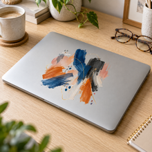 Abstract artwork applied to a silver laptop